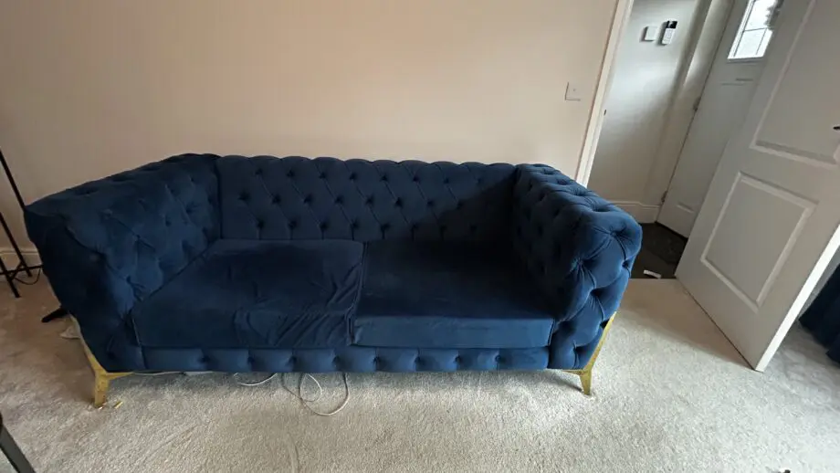 Royal blue chesterfield style fabric sofa