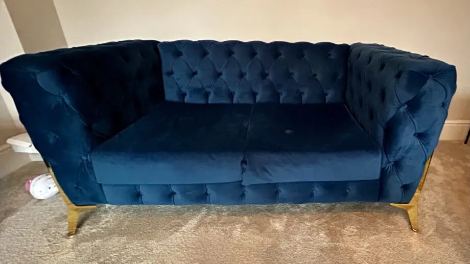 Royal blue chesterfield style fabric sofa