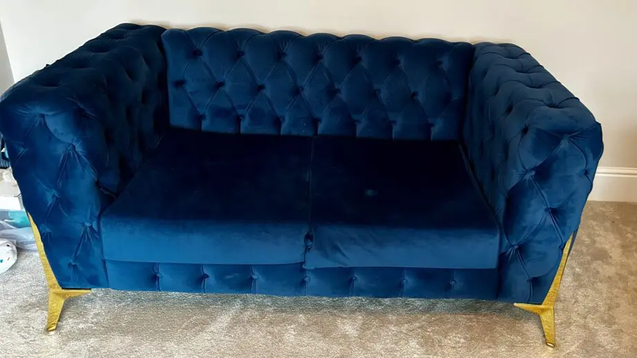 Royal blue chesterfield style fabric sofa