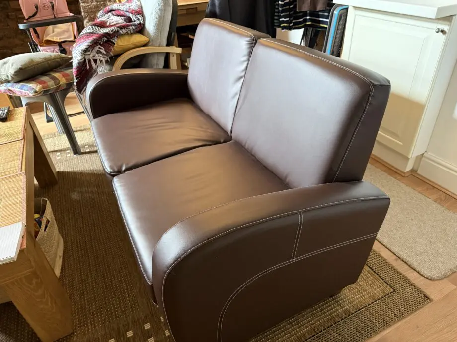 Faux brown leather sofa for sale