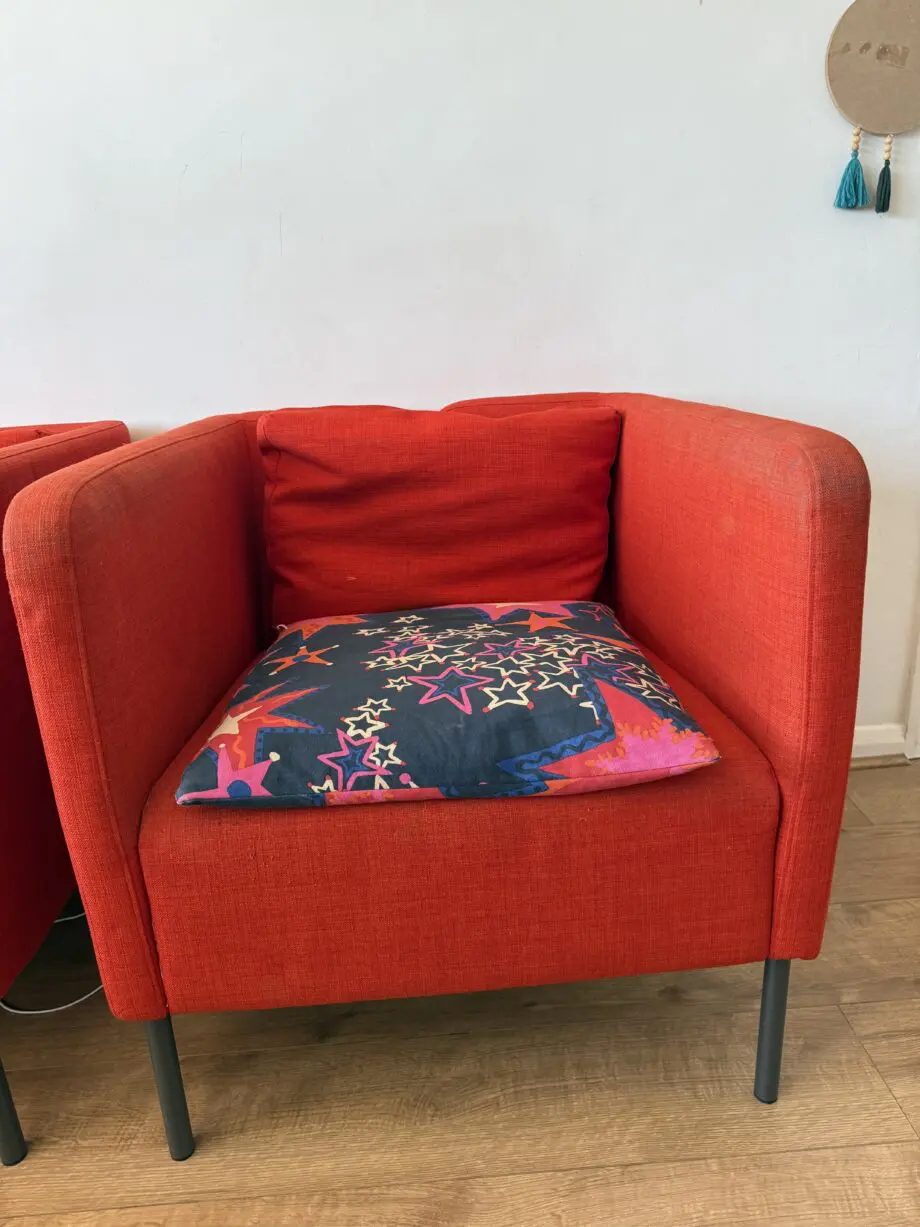 Red Ikea Sofa Chair with cushions