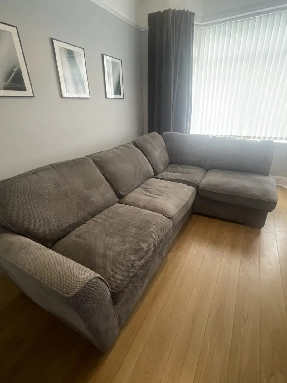 Grey corner left hand sofa with footstool