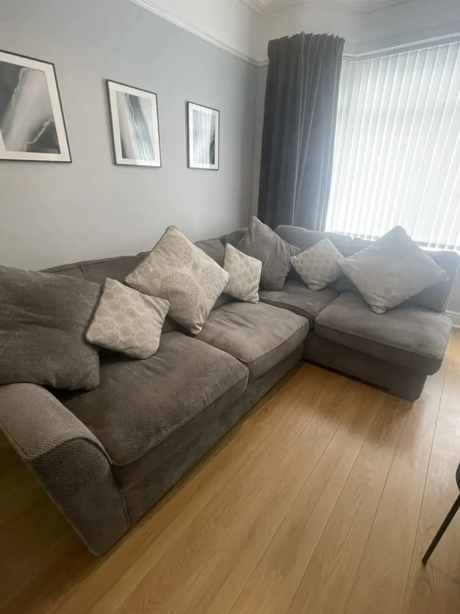 Grey corner left hand sofa with footstool