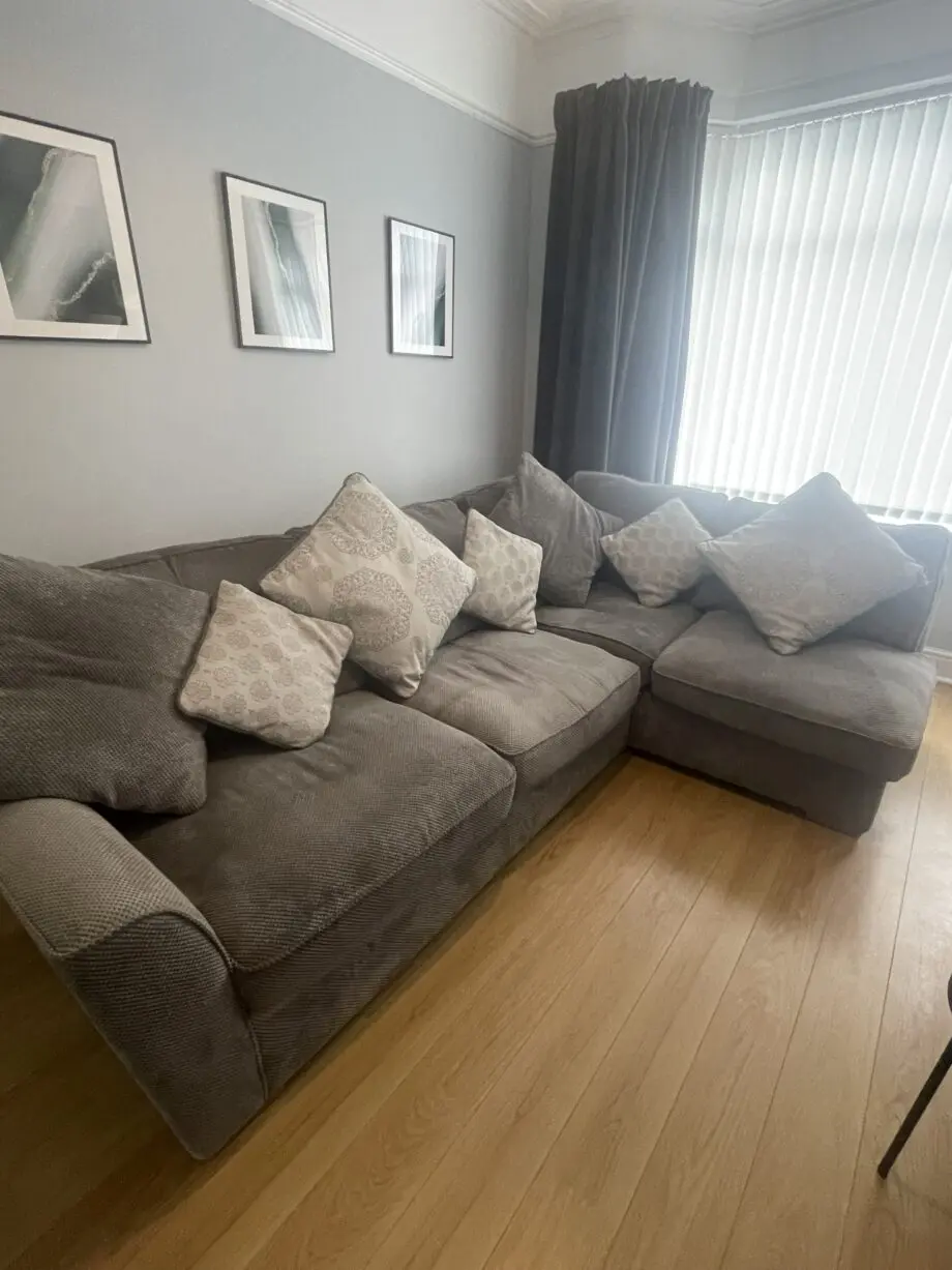 Grey corner left hand sofa with footstool