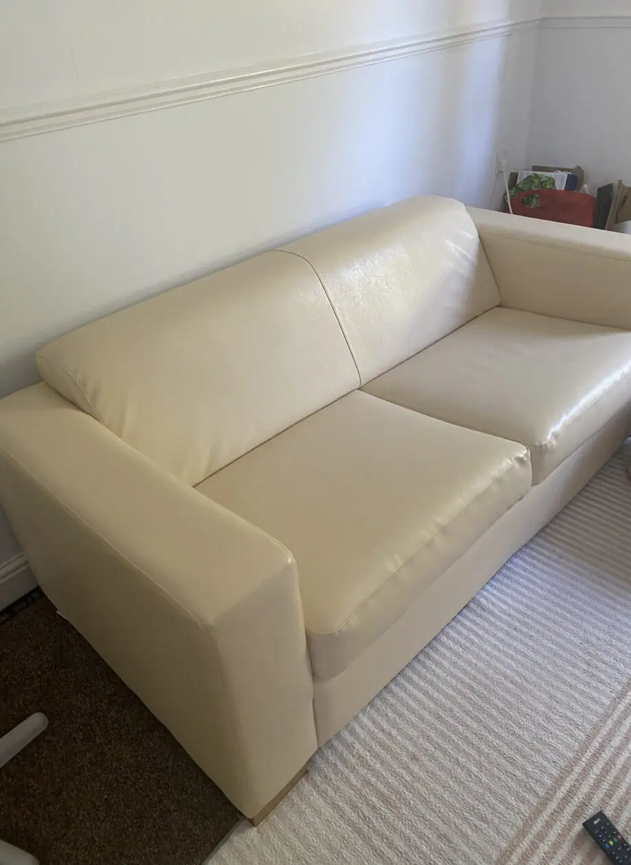 Faux cream leather sofa + beanbag style footstool Like new condition