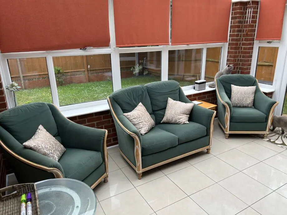 Dark green velvet-type love seat x 2 with light wood trim
