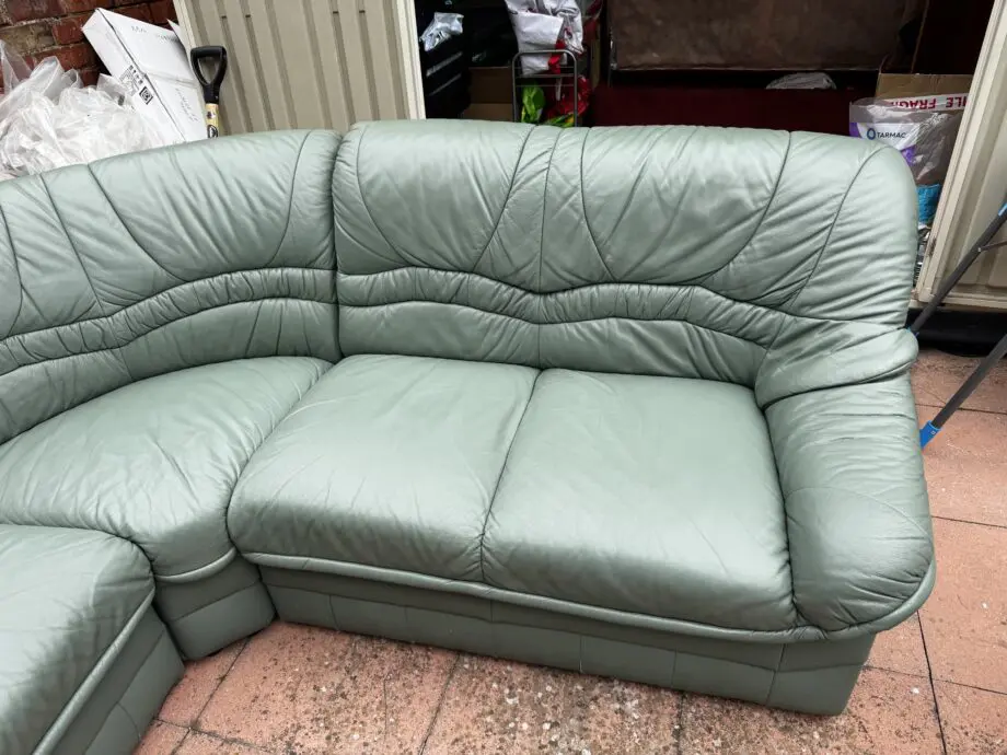 Green leather corner sofa