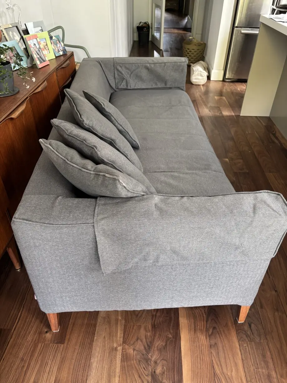 Dwell grey sofa with plumbs slip cover