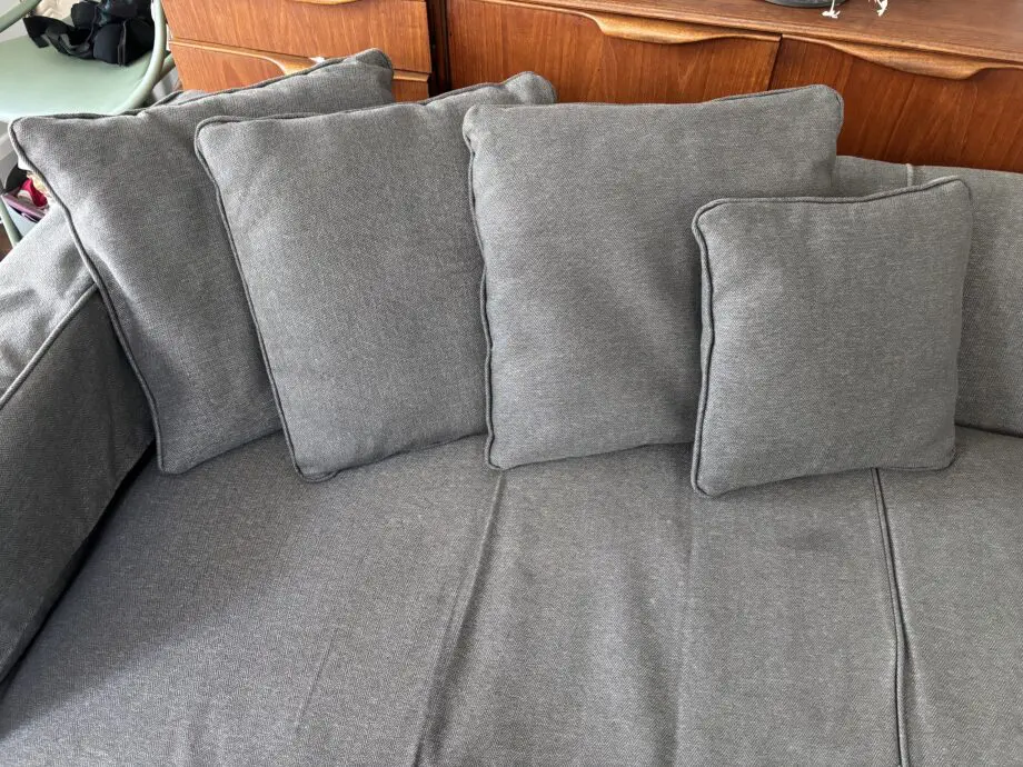 Dwell grey sofa with plumbs slip cover