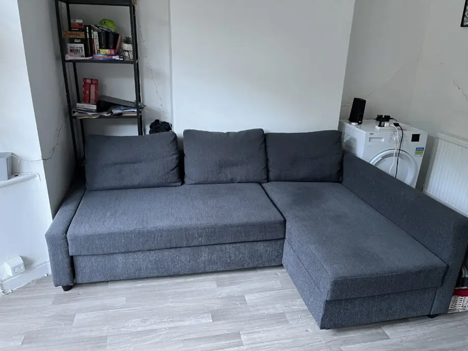 Dark grey sofa bed with storage