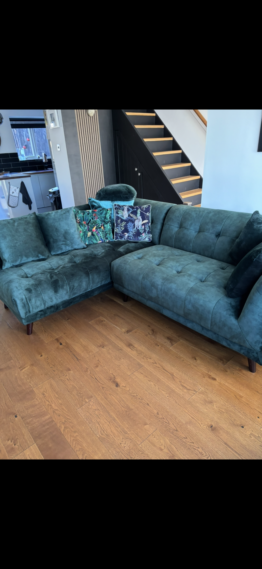 Bottle green corner sofa with footstool