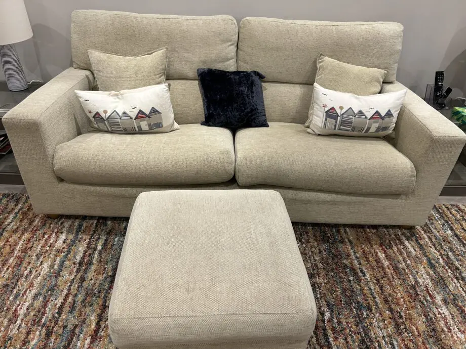 Beige 3 seater and 2 seater sofa with footstool