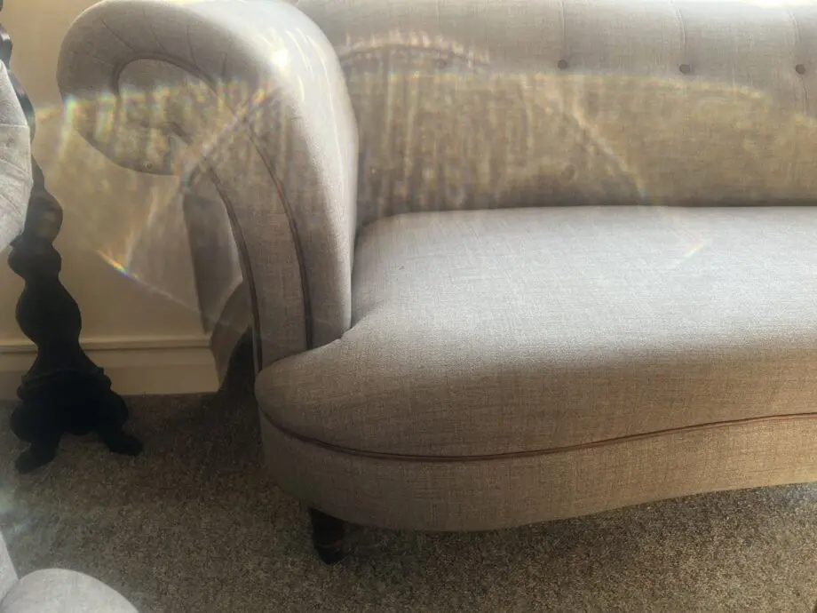 DFS greyish with brown trimming. With dark wood feet.