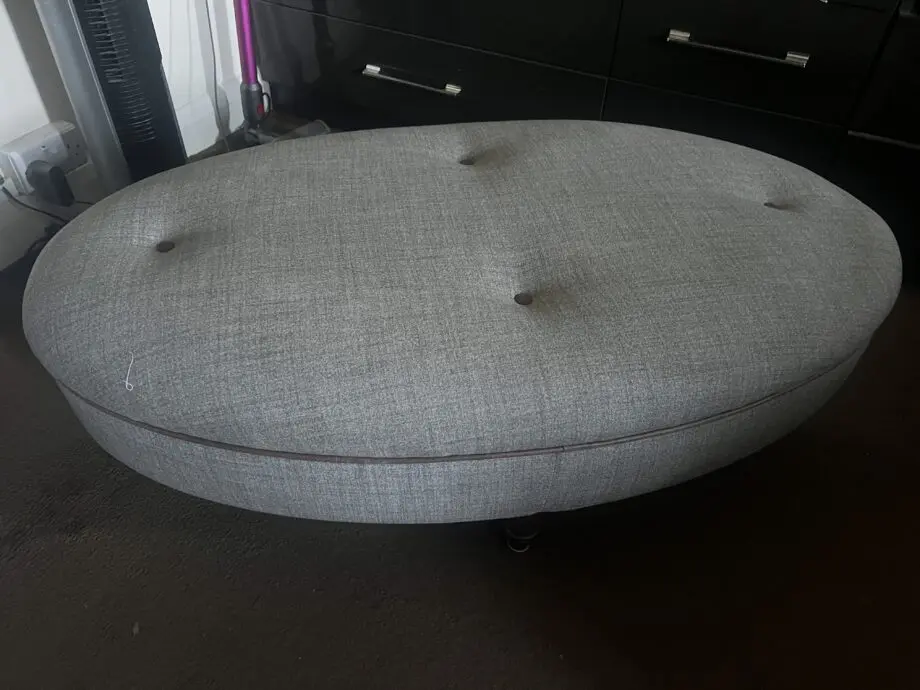 DFS greyish with brown trimming. With dark wood feet.