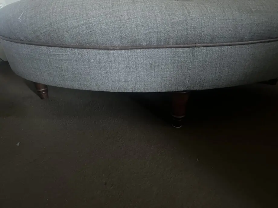 DFS greyish with brown trimming. With dark wood feet.