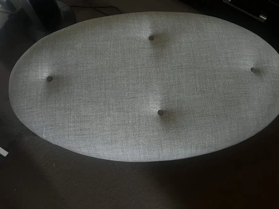 DFS greyish with brown trimming. With dark wood feet.
