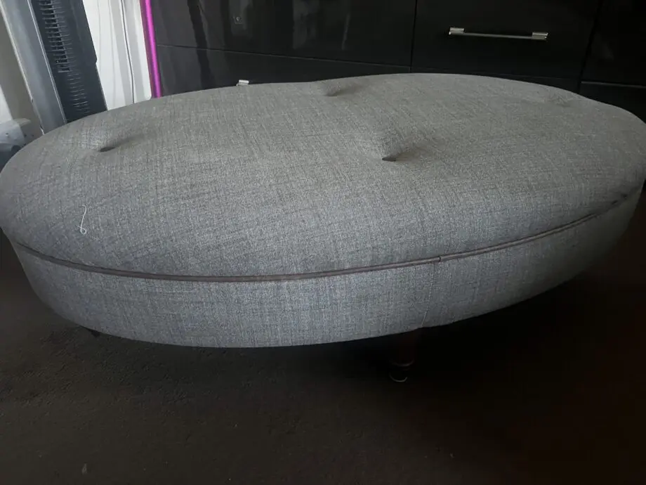 DFS greyish with brown trimming. With dark wood feet.