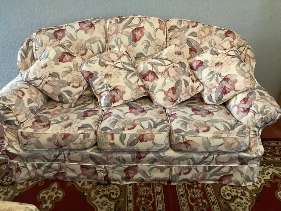 Brown sofa with custom covers and pillows