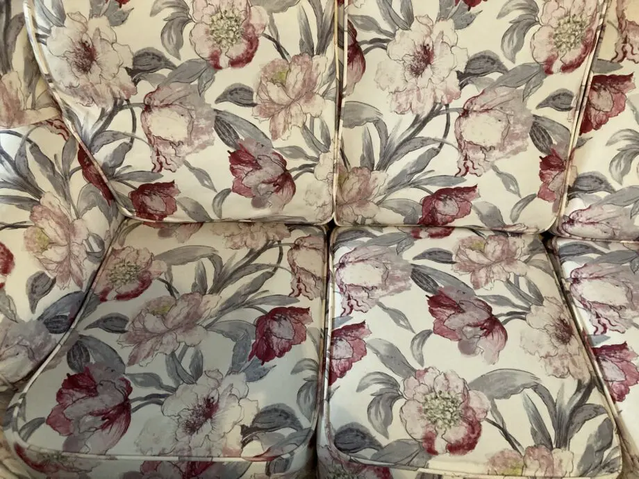 Brown sofa with custom covers and pillows