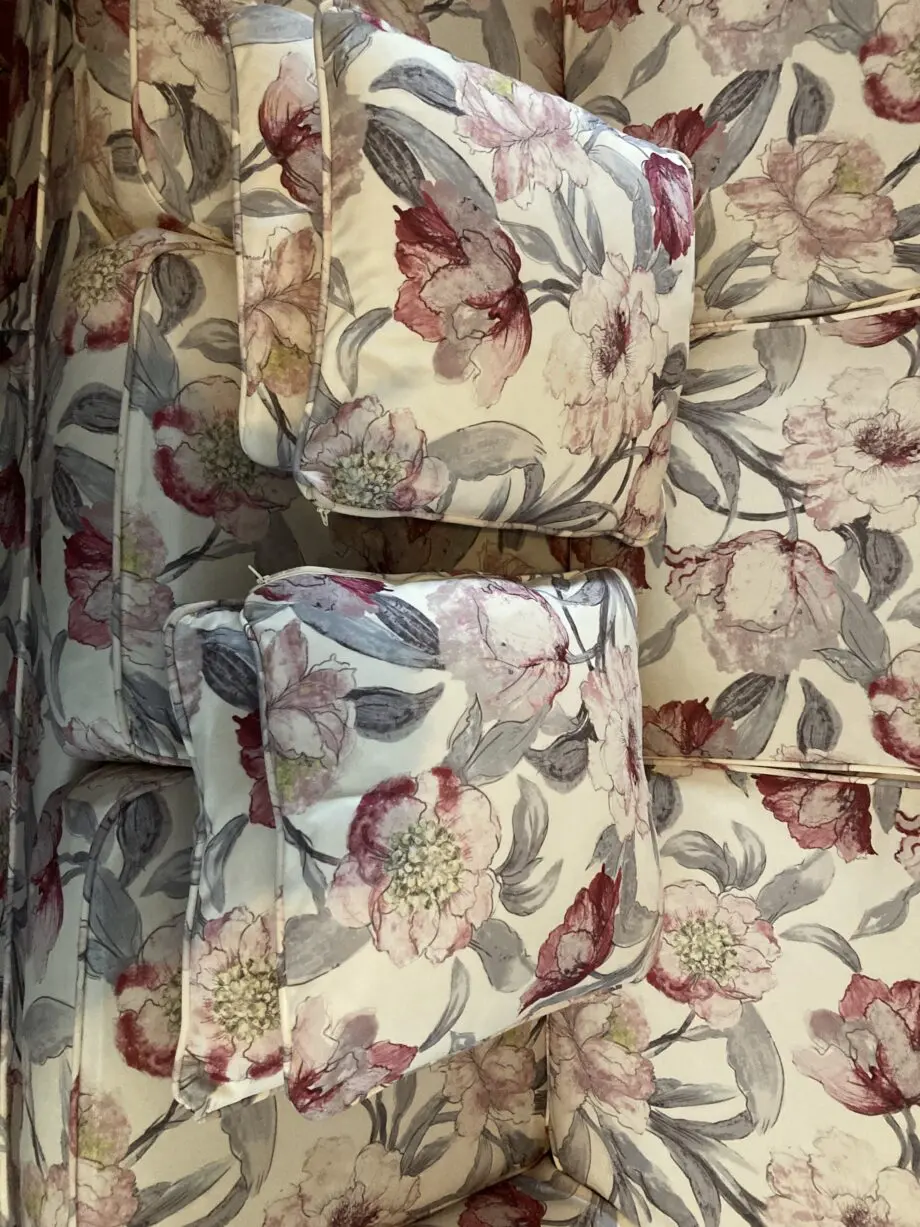 Brown sofa with custom covers and pillows