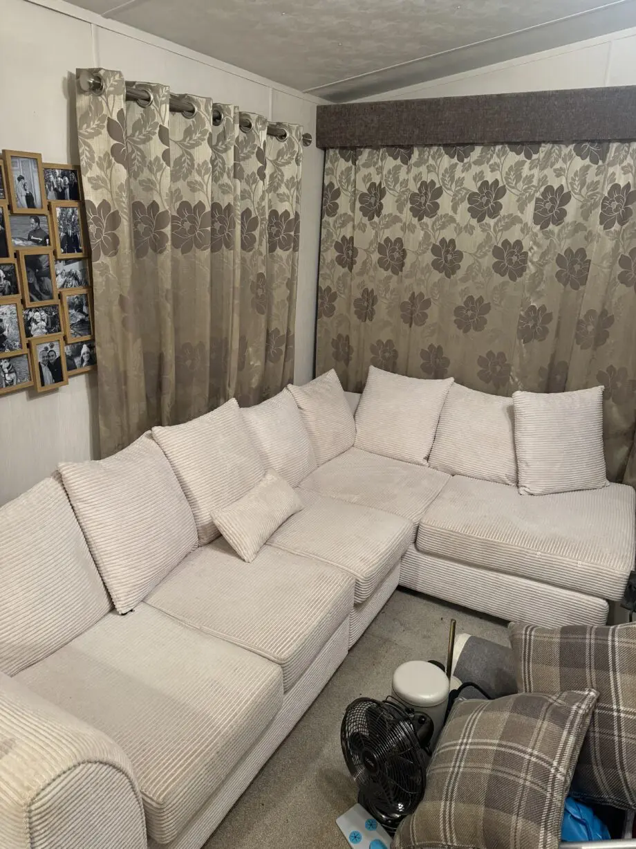 White fabric corner sofa