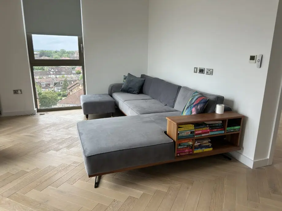 Corner sofa, with bookshelf in arm