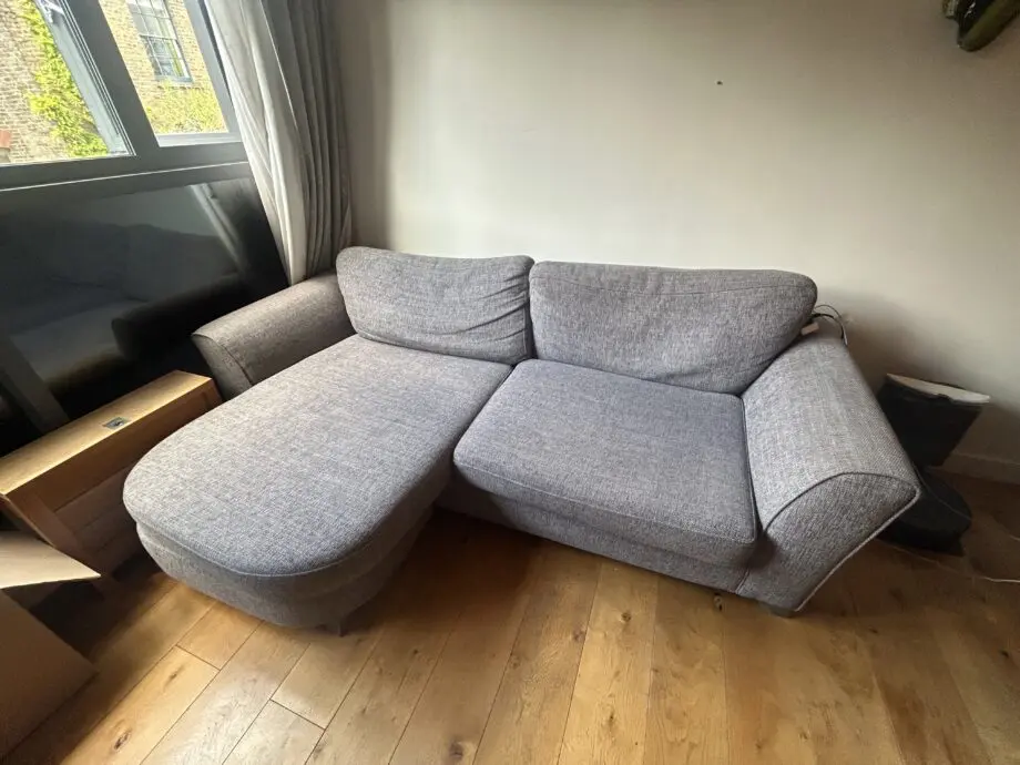 Grey 2-seater sofa with chaise