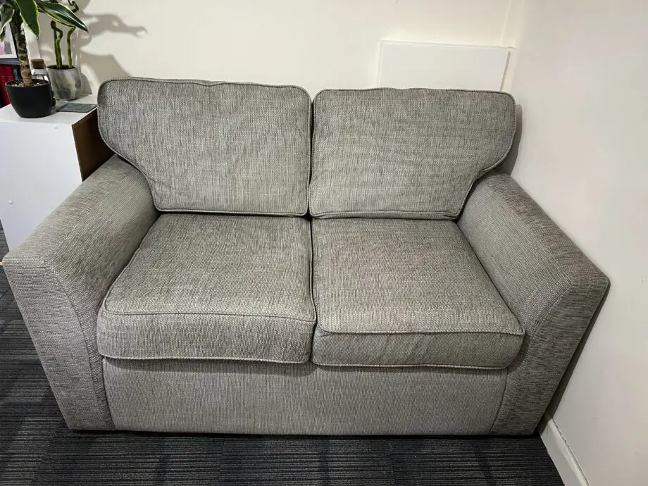 Grey two seater sofa