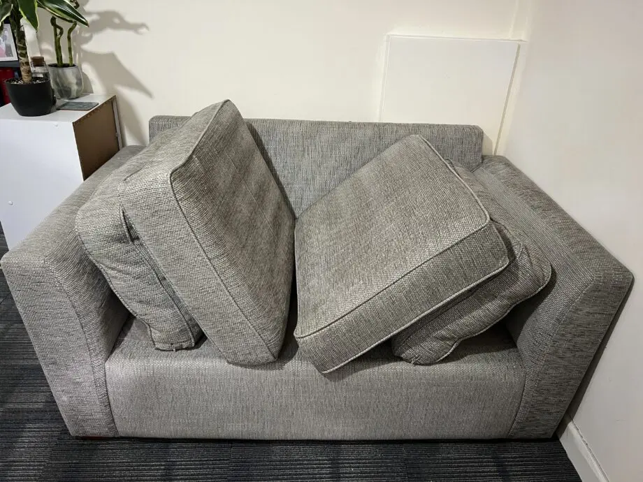Grey two seater sofa