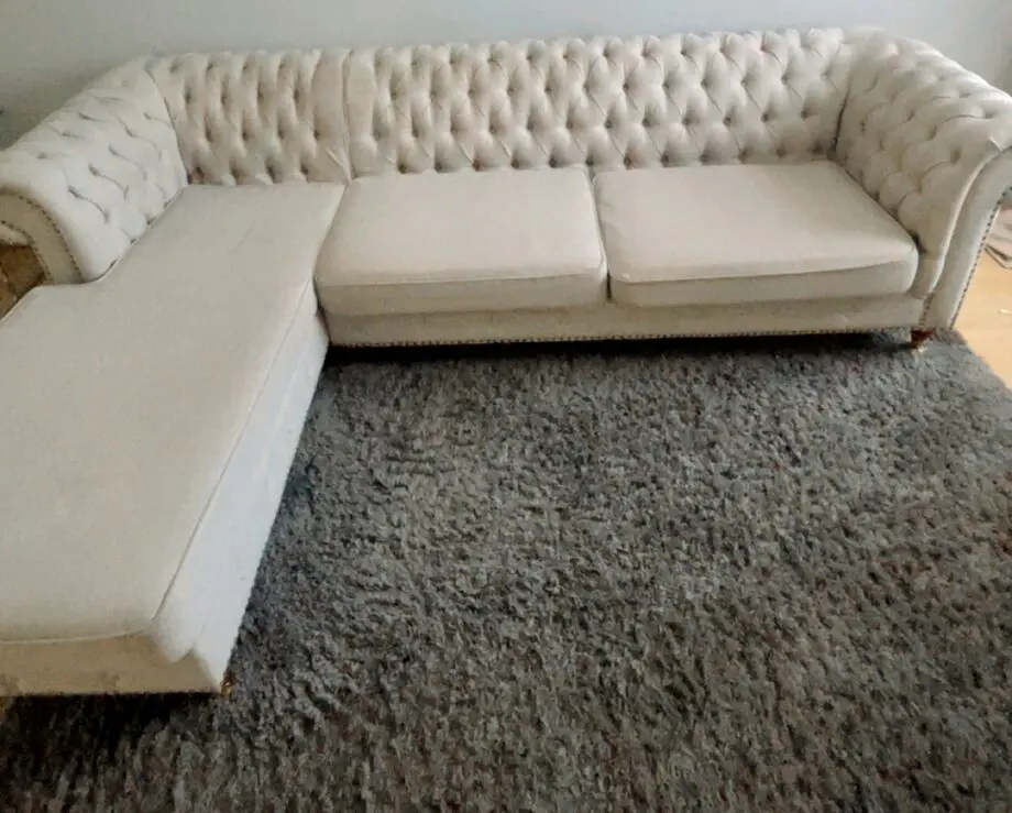 3 seater Grey Linen Left Facing Chesterfield Corner Chaise and a Grey White Round Linen Deep Buttoned Ottoman with Studded Edge