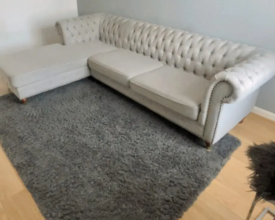 3 seater Grey Linen Left Facing Chesterfield Corner Chaise and a Grey White Round Linen Deep Buttoned Ottoman with Studded Edge