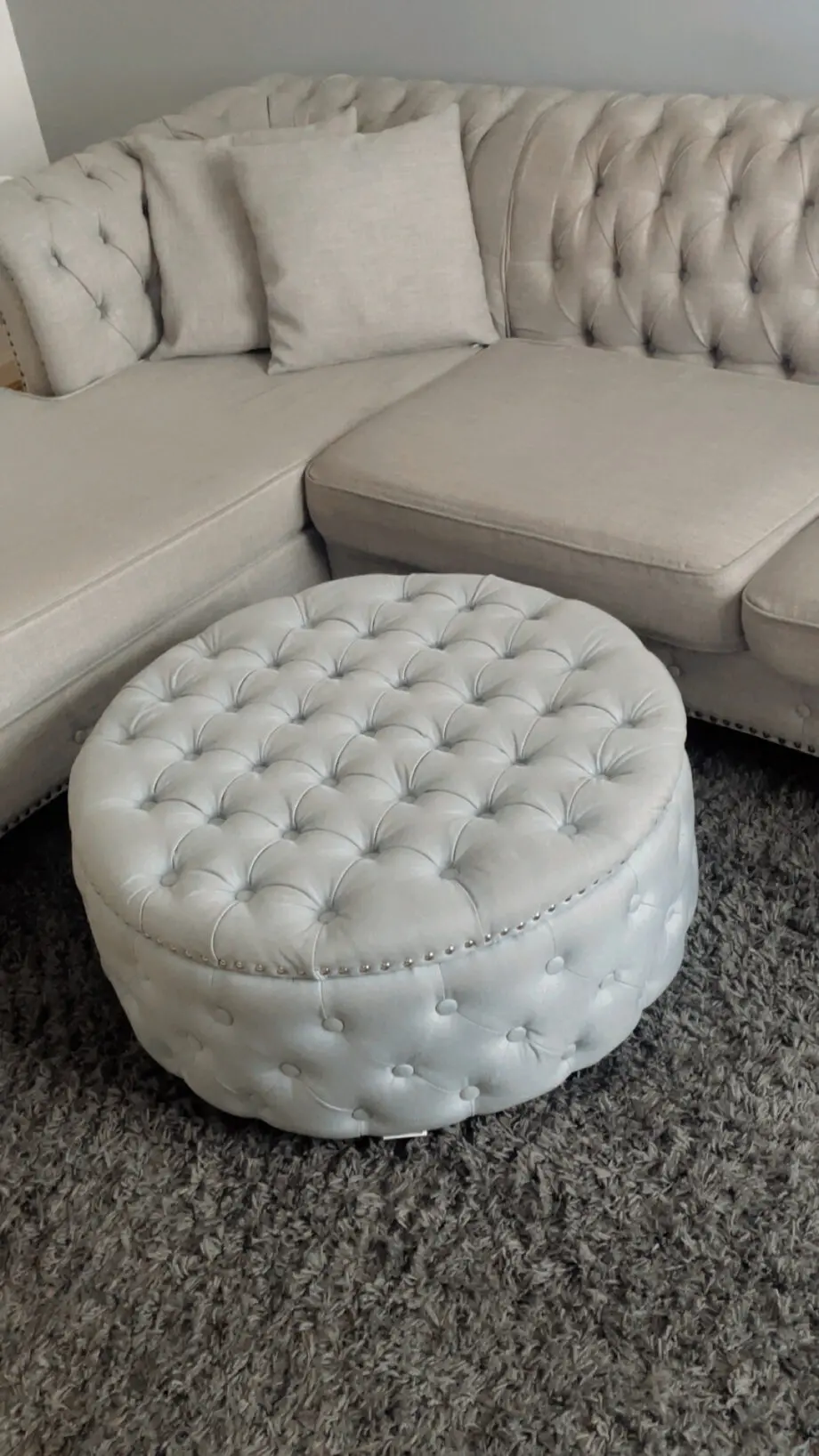 3 seater Grey Linen Left Facing Chesterfield Corner Chaise and a Grey White Round Linen Deep Buttoned Ottoman with Studded Edge