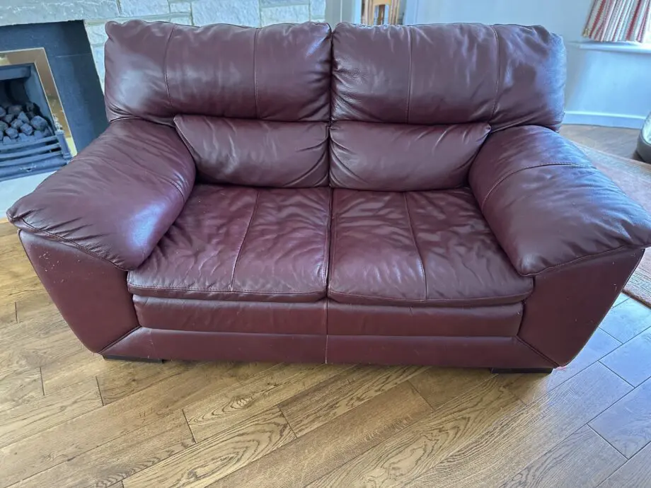 Leather 2 seater sofa, some wear.