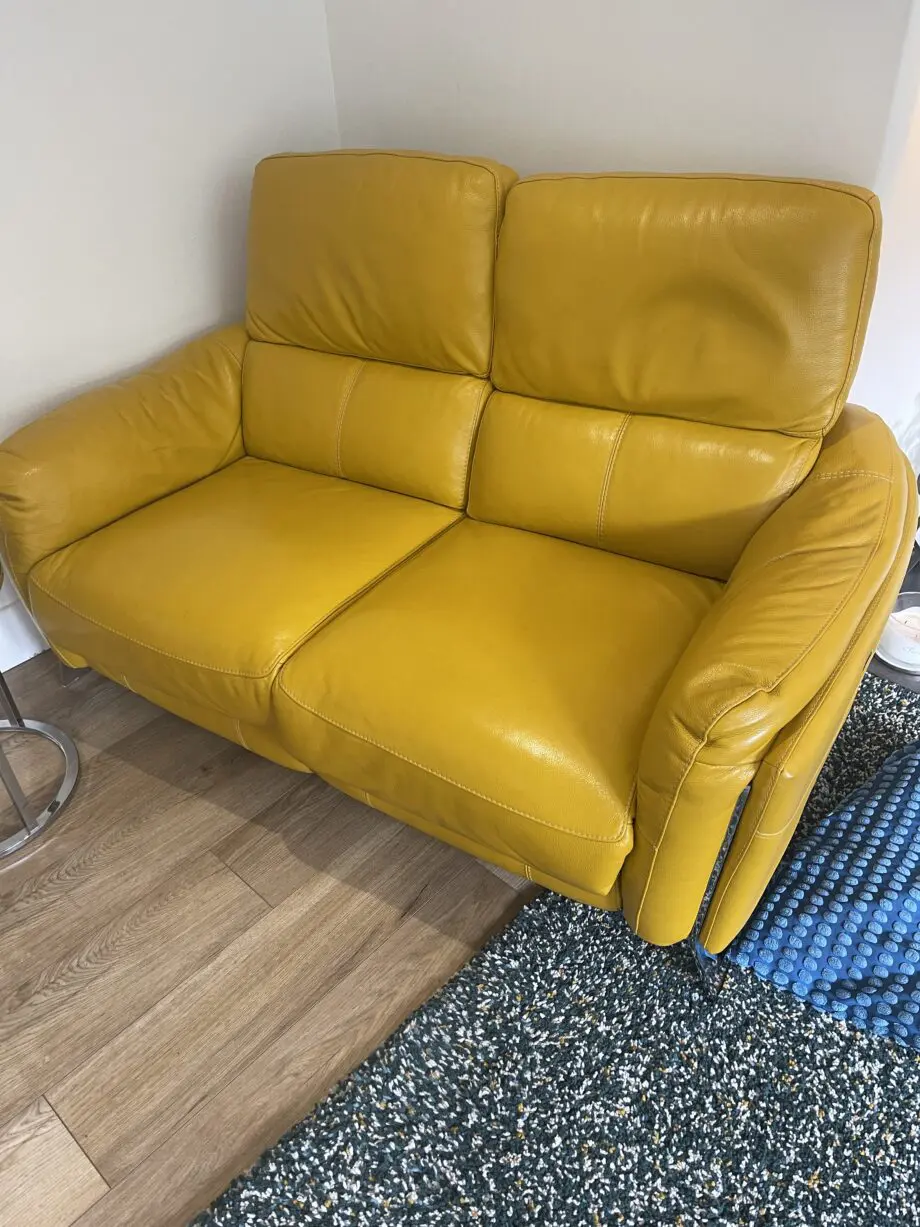 Furniture village 2 seater power recliner in NC leather and opening footstool in