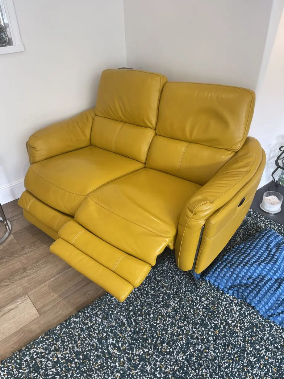 Furniture village 2 seater power recliner in NC leather and opening footstool in