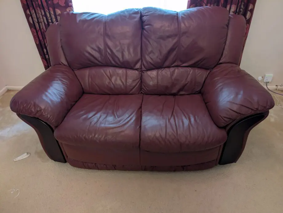 DFS Burgundy/Maroon Leather 2 seater sofa