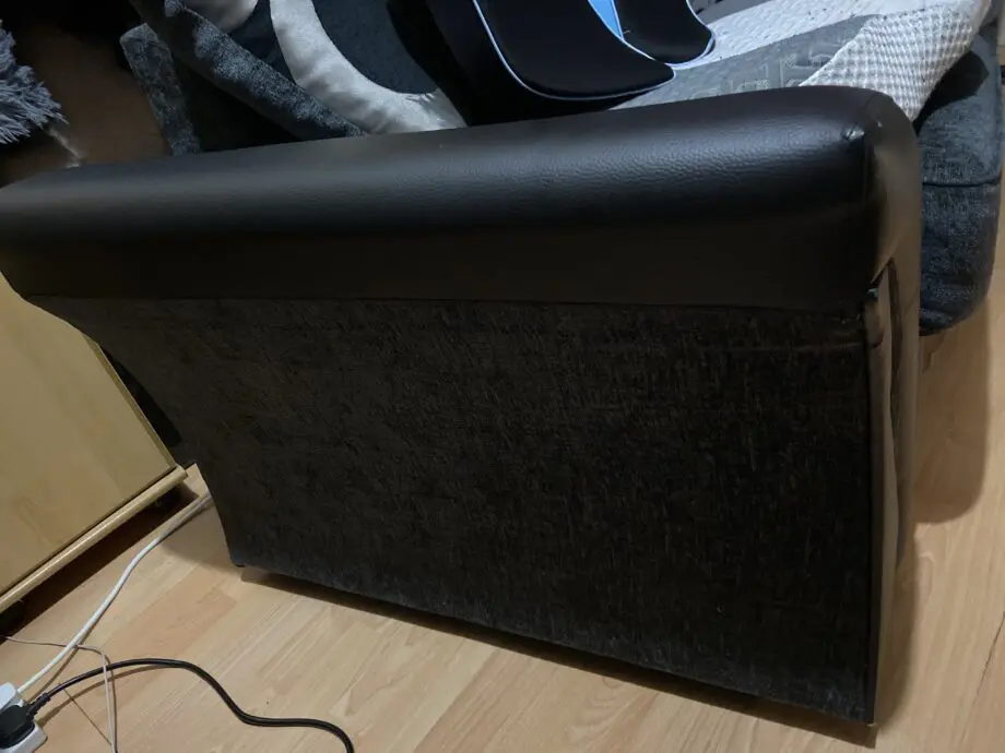 Unknown + black and charcoal cushion + two seated sofa