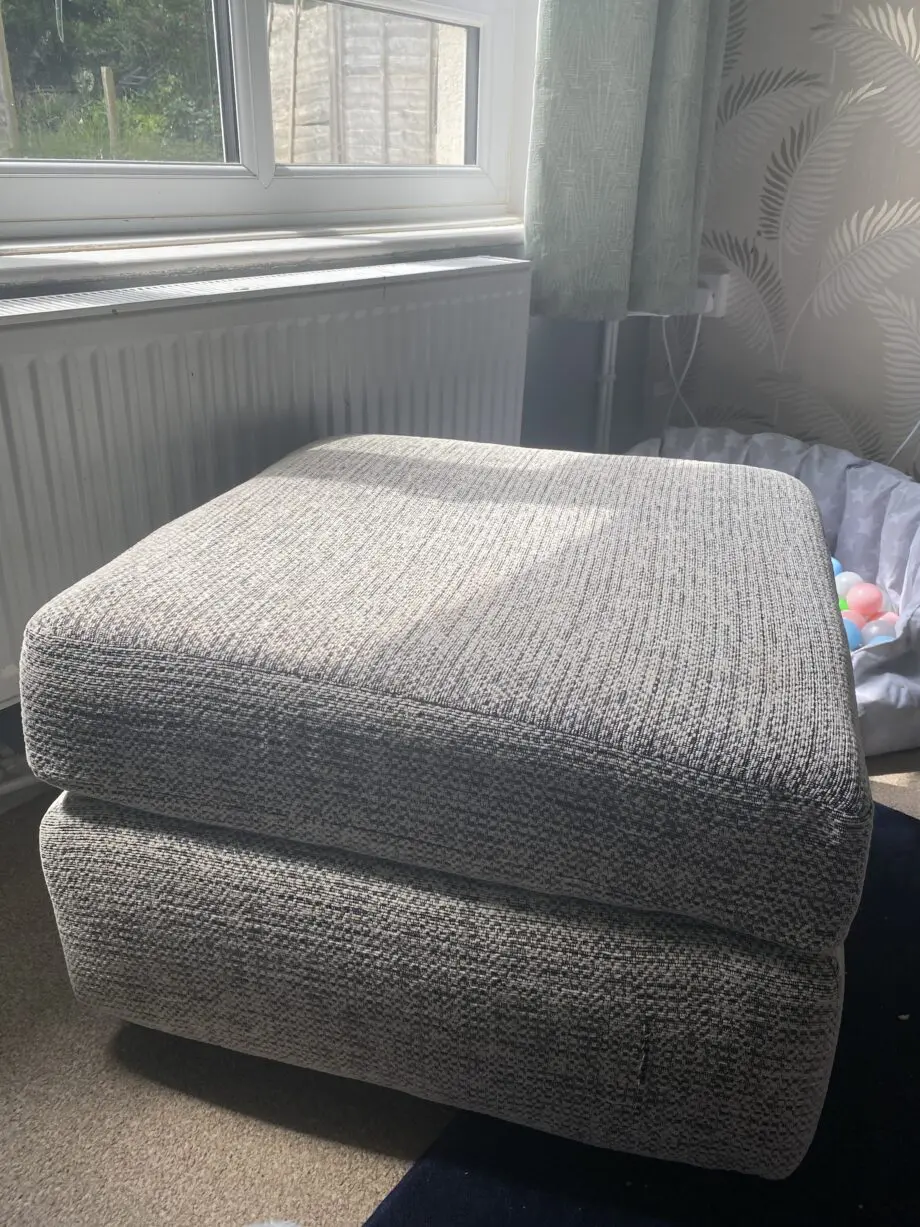 Two 3 seater grey speckled sofas and footstool