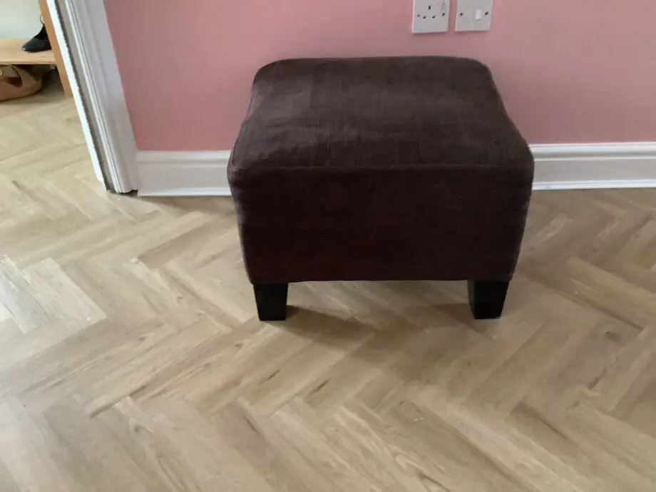 Brown fabric and 4 seater couch with matching chair and footstool.