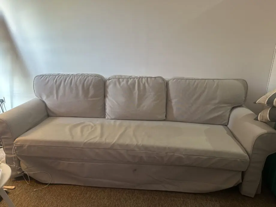 Light gray sofa very comfortable and can be a bed from ikea