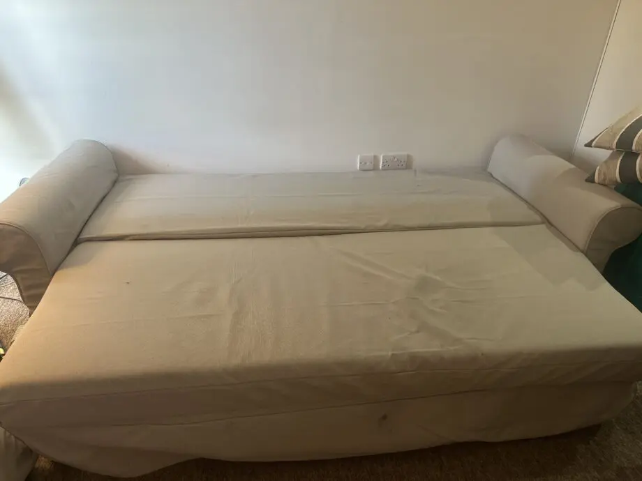 Light gray sofa very comfortable and can be a bed from ikea