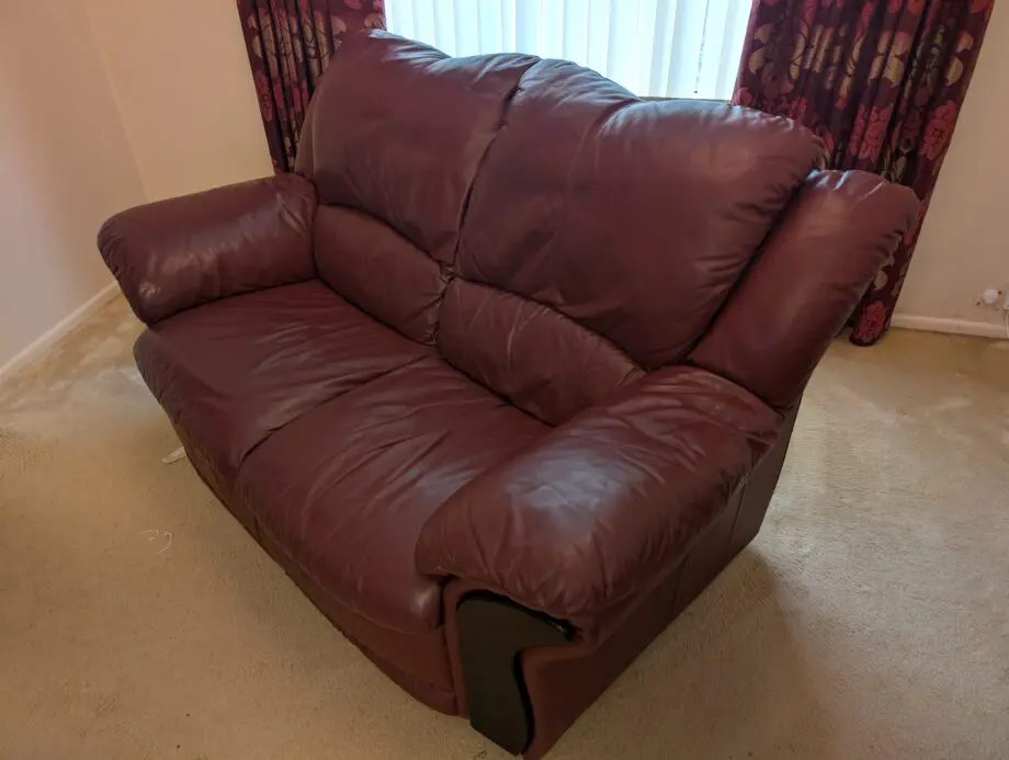 DFS Burgundy/Maroon Leather 2 seater sofa