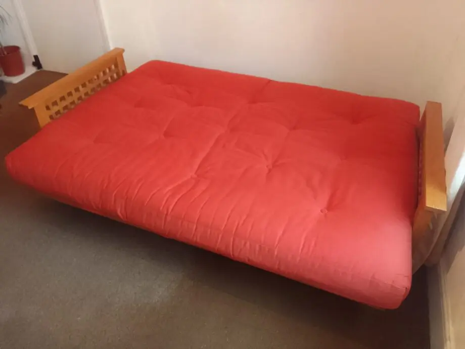 Sofa bed. Cambridgefutons.com. Handmade organic materials, 100% free of chemicals. Light orange.