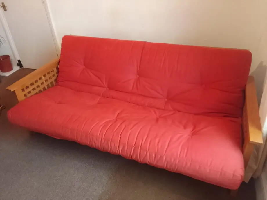 Sofa bed. Cambridgefutons.com. Handmade organic materials, 100% free of chemicals. Light orange.