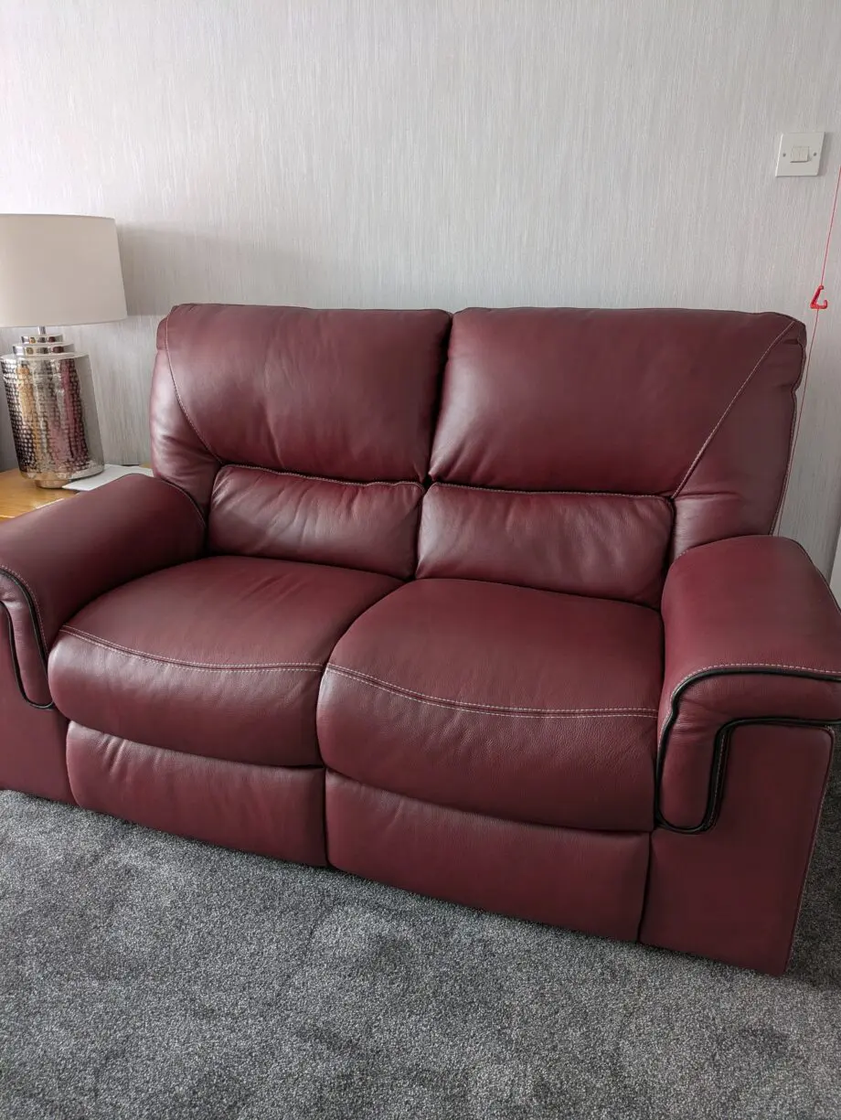 Large 2 x 2 seater leather sofas in red wine