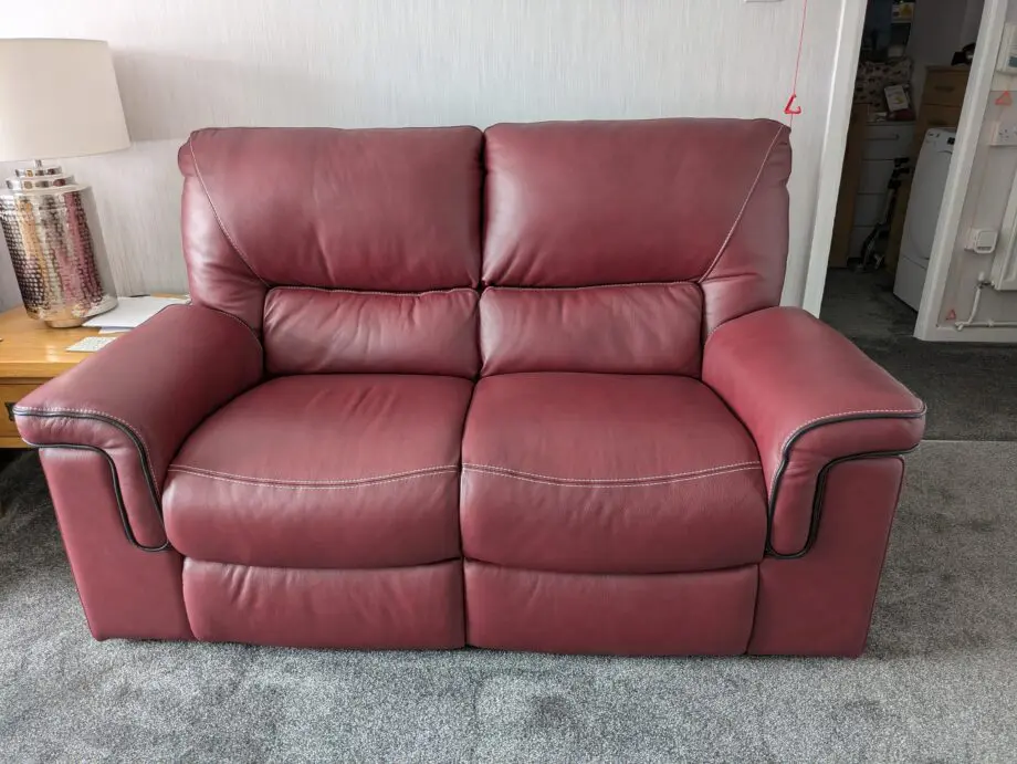 Large 2 x 2 seater leather sofas in red wine