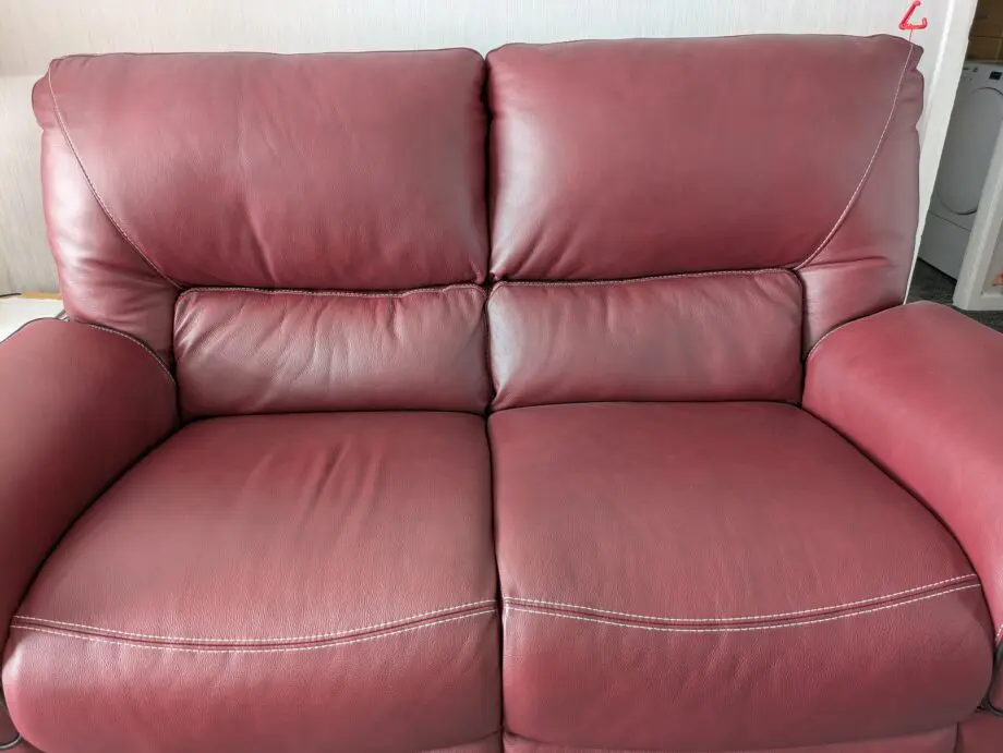 Large 2 x 2 seater leather sofas in red wine
