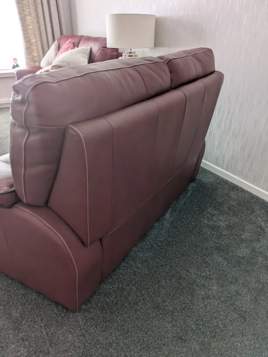 Large 2 x 2 seater leather sofas in red wine