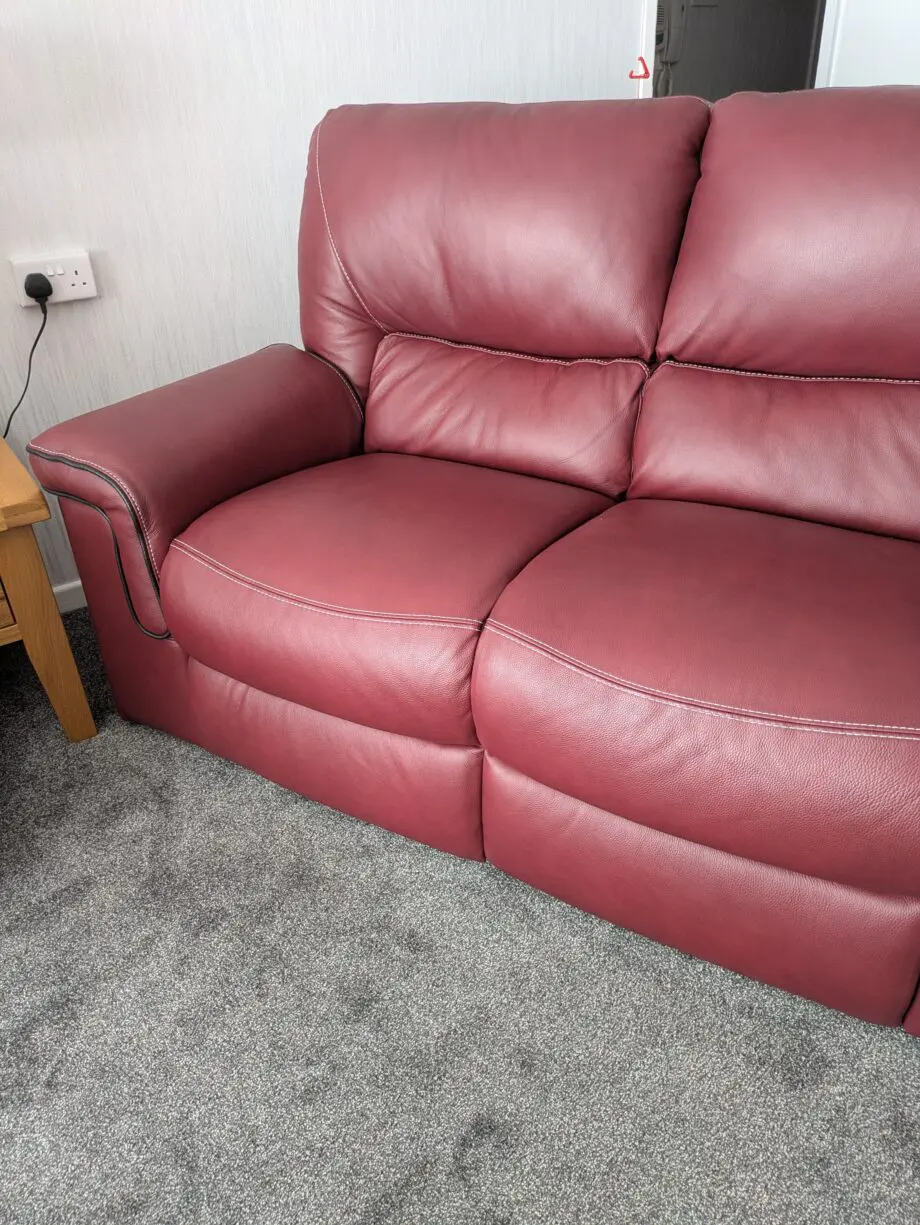 Large 2 x 2 seater leather sofas in red wine