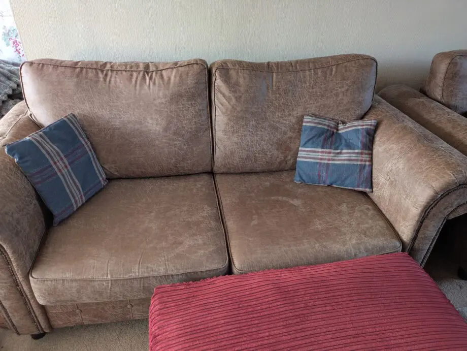 Faux leather sofa, armchair and pouffe